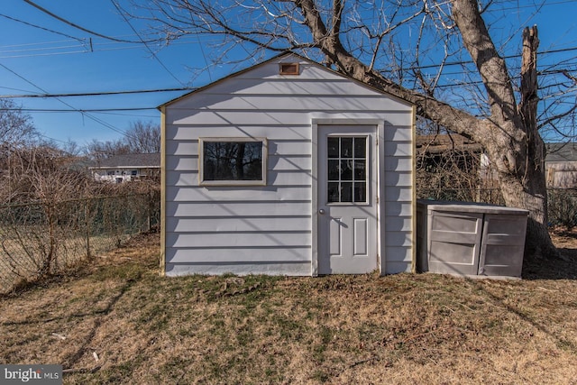 view of shed with fence