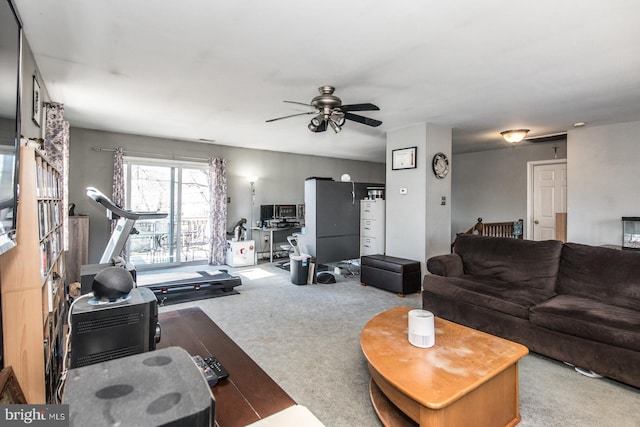 carpeted living room with ceiling fan