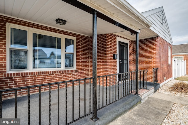 property entrance with brick siding