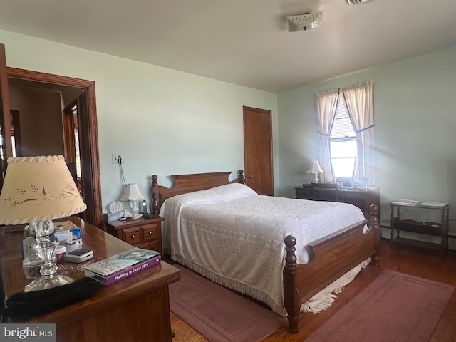 bedroom featuring wood finished floors