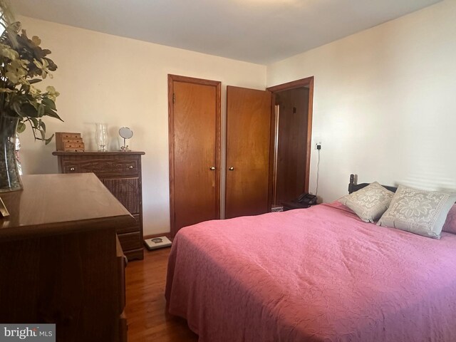 bedroom featuring wood finished floors