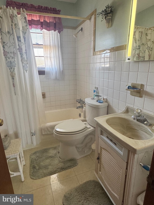 full bathroom featuring vanity, tile patterned flooring, shower / bath combination with curtain, tile walls, and toilet