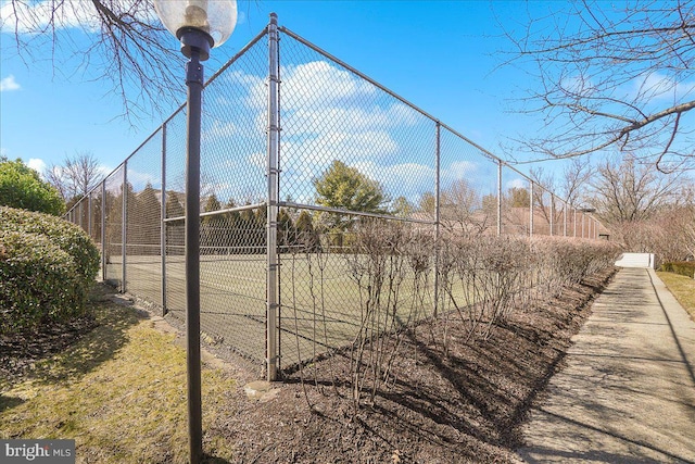 view of community with fence