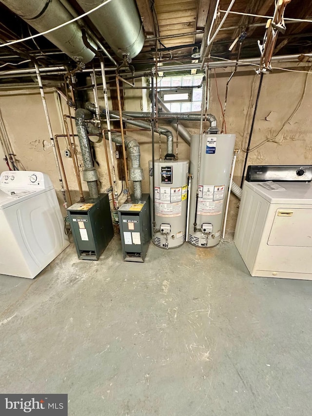 utilities with a heating unit, gas water heater, and washer / dryer