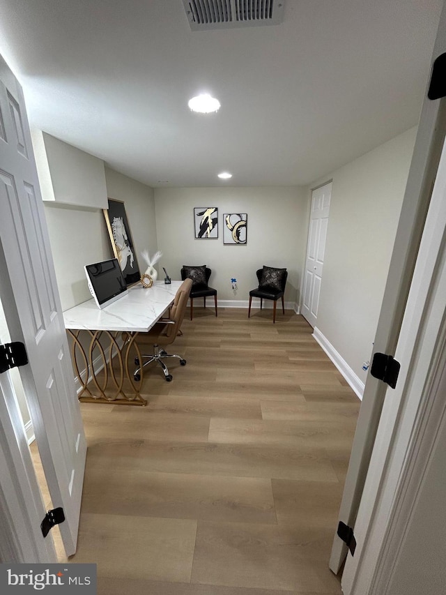 office with visible vents, recessed lighting, baseboards, and light wood-style floors