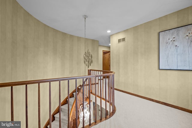 corridor with recessed lighting, an upstairs landing, visible vents, and baseboards