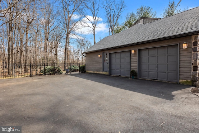 garage with fence