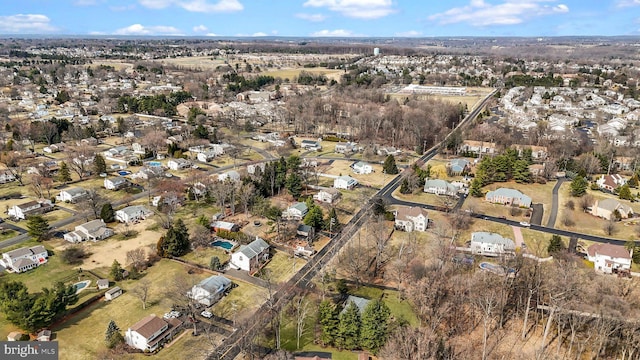 birds eye view of property with a residential view