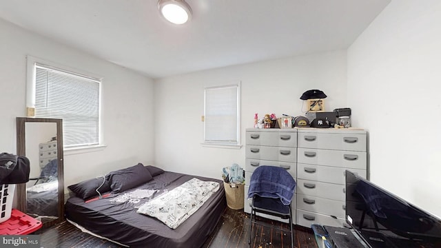 bedroom featuring wood finished floors