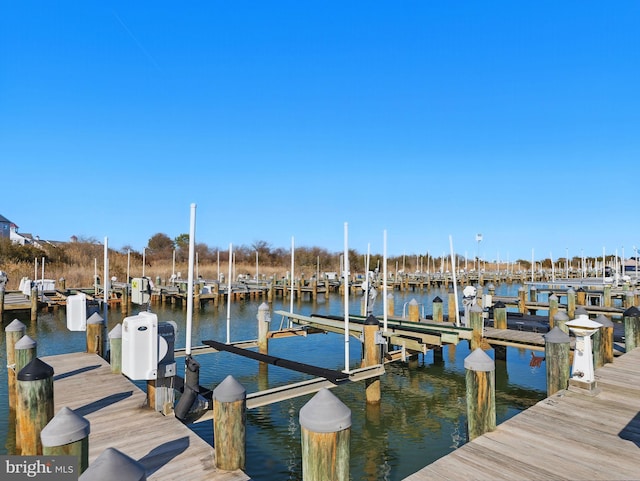 dock area featuring a water view and boat lift