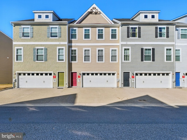 townhome / multi-family property with a garage