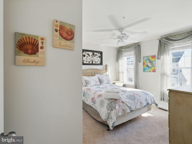 carpeted bedroom featuring ceiling fan