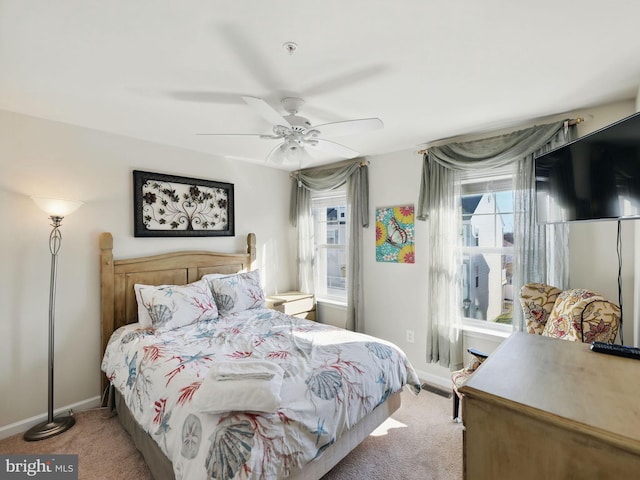 bedroom featuring carpet flooring, a ceiling fan, and baseboards