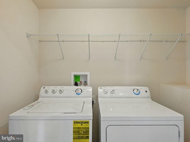 laundry area with laundry area and washer and clothes dryer