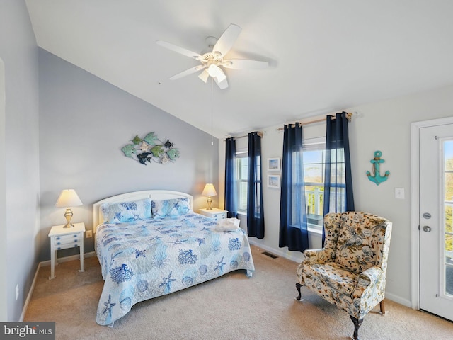 bedroom featuring visible vents, carpet floors, baseboards, and vaulted ceiling