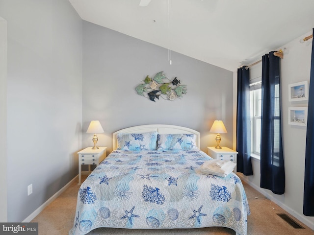 carpeted bedroom with visible vents and baseboards