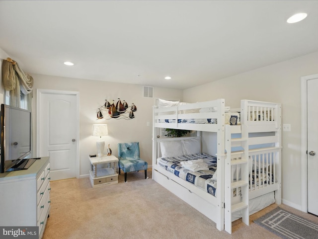 bedroom featuring baseboards, recessed lighting, visible vents, and light carpet