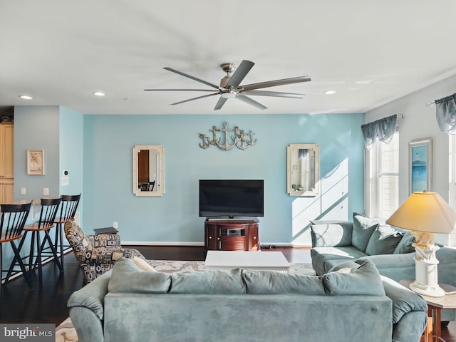 living area featuring dark wood finished floors, recessed lighting, baseboards, and a ceiling fan