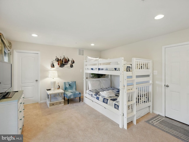 bedroom with light carpet, visible vents, recessed lighting, and baseboards