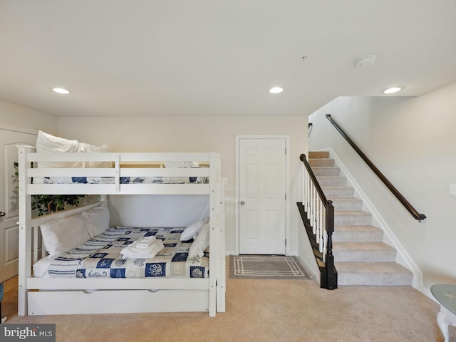 bedroom with recessed lighting, baseboards, and carpet