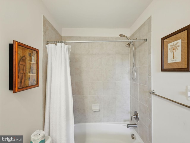 bathroom with shower / tub combo