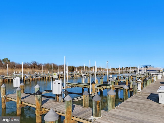 dock area featuring a water view and boat lift