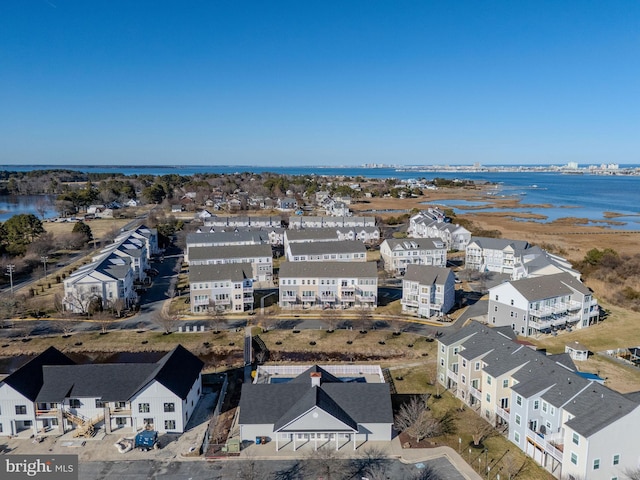 birds eye view of property with a residential view and a water view