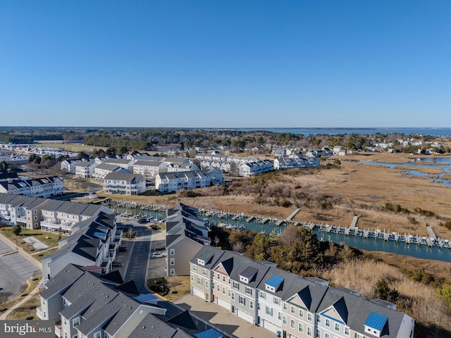 birds eye view of property featuring a residential view and a water view