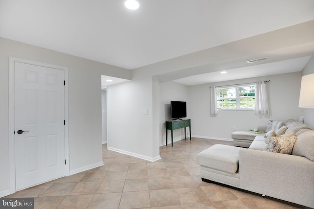 living area featuring recessed lighting, visible vents, baseboards, and light tile patterned flooring