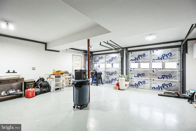 garage with concrete block wall