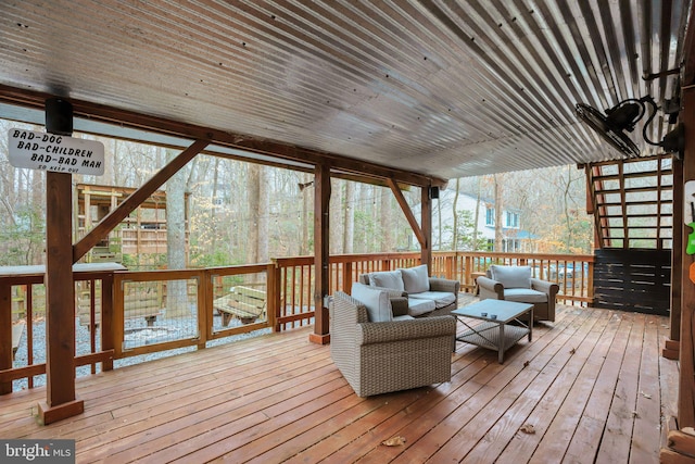 wooden deck featuring outdoor lounge area