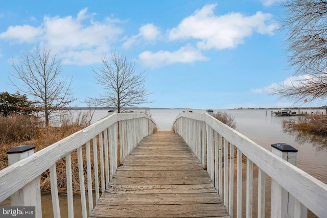 surrounding community with a water view