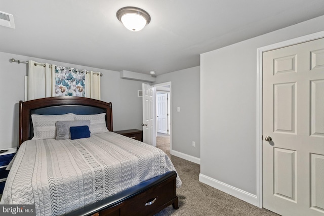 bedroom with visible vents, carpet, and baseboards