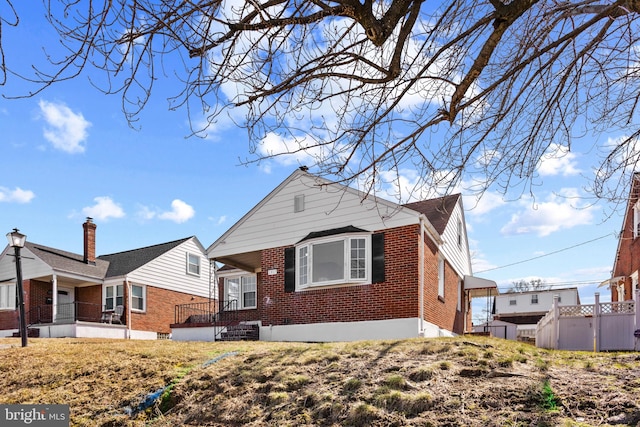 view of front of house with brick siding