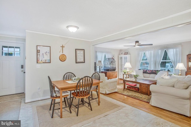 3719 3rd St, North Beach, MD 20714 - dining space featuring crown molding, ceiling fan, light wood-style flooring, and baseboards
