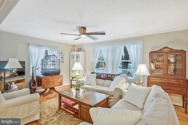 3719 3rd St, North Beach, MD 20714 - living area featuring ceiling fan, wood finished floors, and crown molding