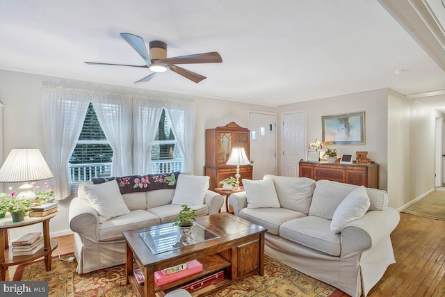 3719 3rd St, North Beach, MD 20714 - living area with ceiling fan, light wood-type flooring, and baseboards