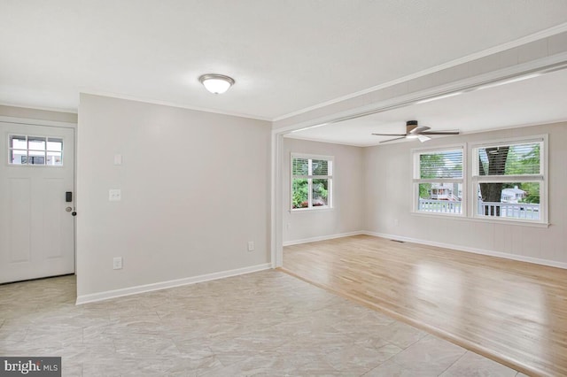 3719 3rd St, North Beach, MD 20714 - unfurnished room with ornamental molding, plenty of natural light, ceiling fan, and baseboards