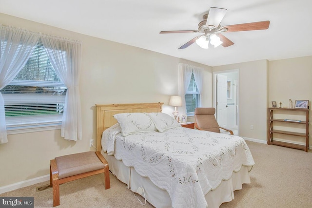 3719 3rd St, North Beach, MD 20714 - bedroom with light colored carpet, baseboards, and ceiling fan