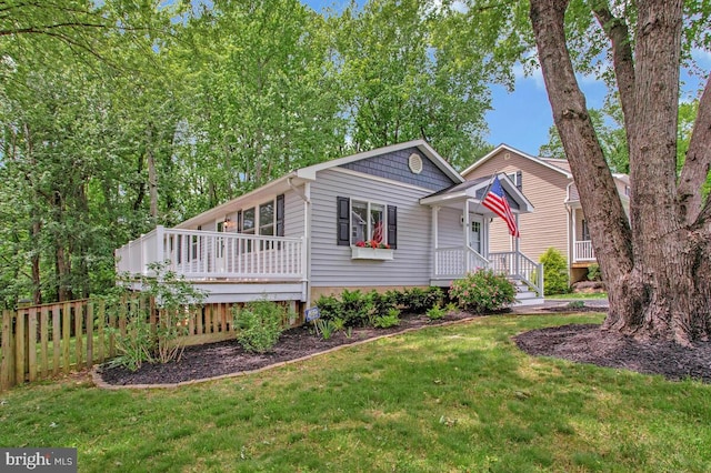 3719 3rd St, North Beach, MD 20714 - view of front of house featuring a wooden deck
