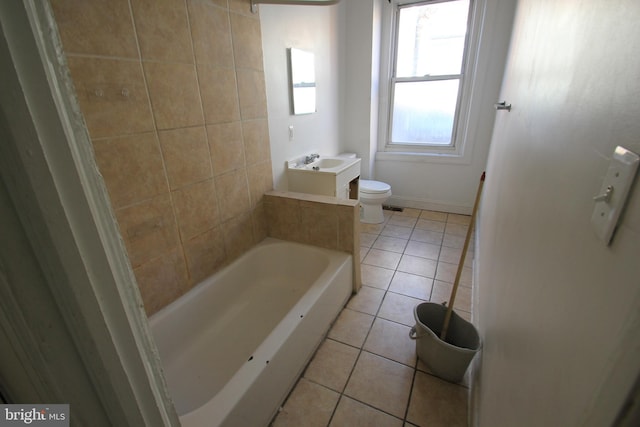 full bath with vanity, tile patterned floors, toilet, and a tub