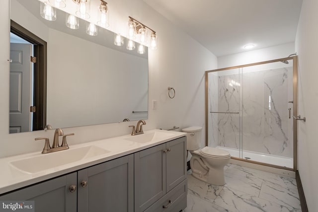 full bath featuring a sink, a marble finish shower, toilet, and marble finish floor