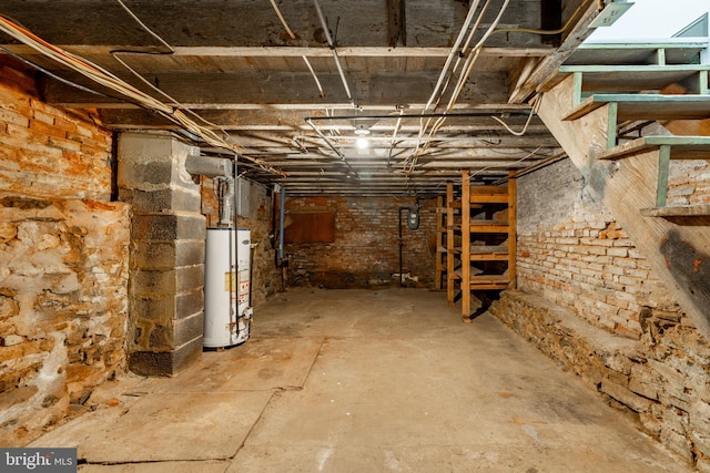 unfinished basement with gas water heater