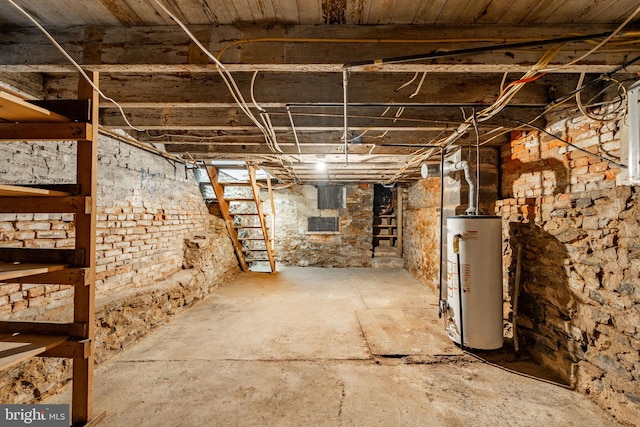 unfinished basement with gas water heater