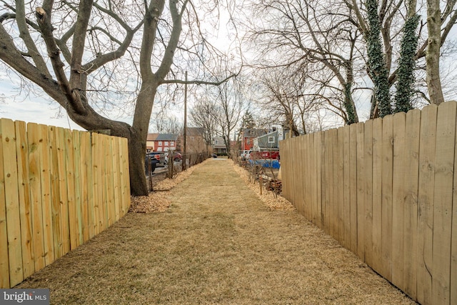 view of yard featuring a residential view and fence