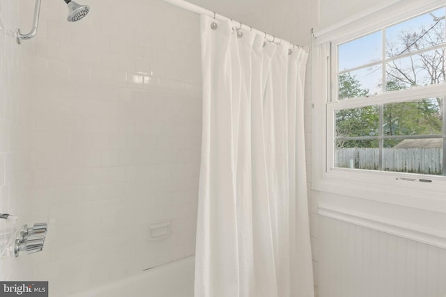 bathroom with shower / bathtub combination with curtain