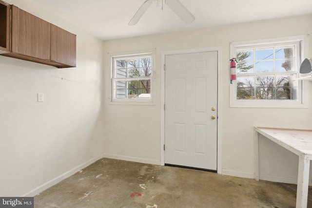 laundry room featuring baseboards and ceiling fan