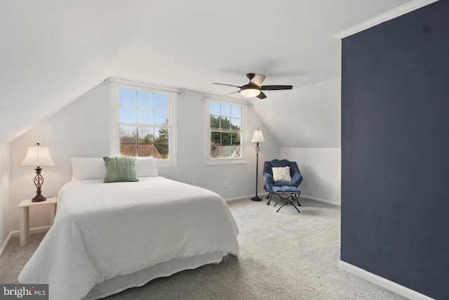 bedroom with baseboards, carpet floors, lofted ceiling, and ceiling fan