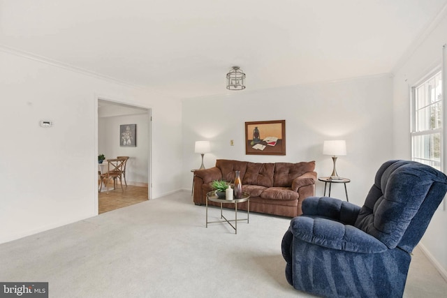 living area featuring light colored carpet and baseboards