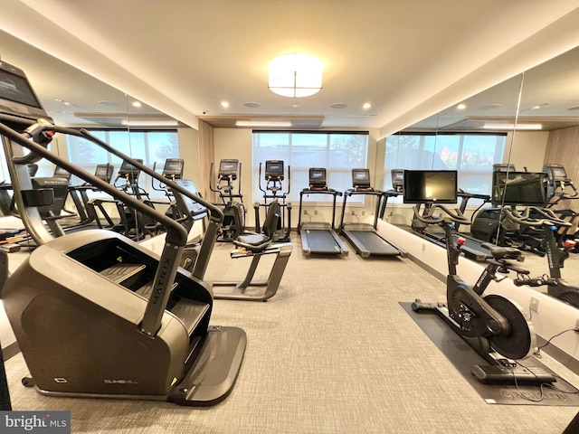 workout area featuring plenty of natural light, recessed lighting, and carpet flooring